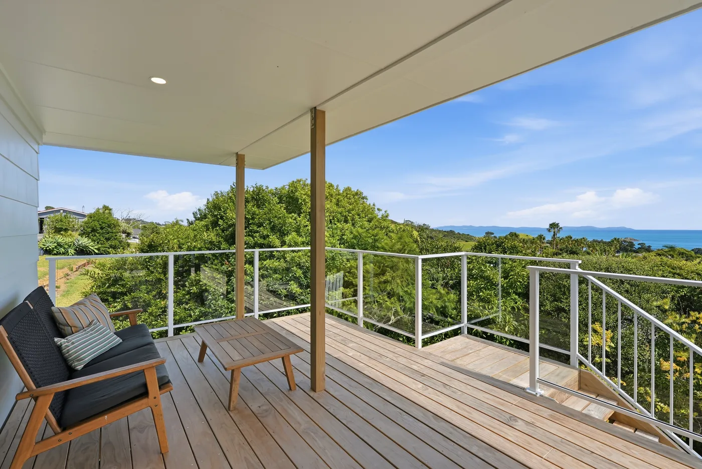 Covered deck looking over bush to the sea at 204 SH10, Coopers Beach