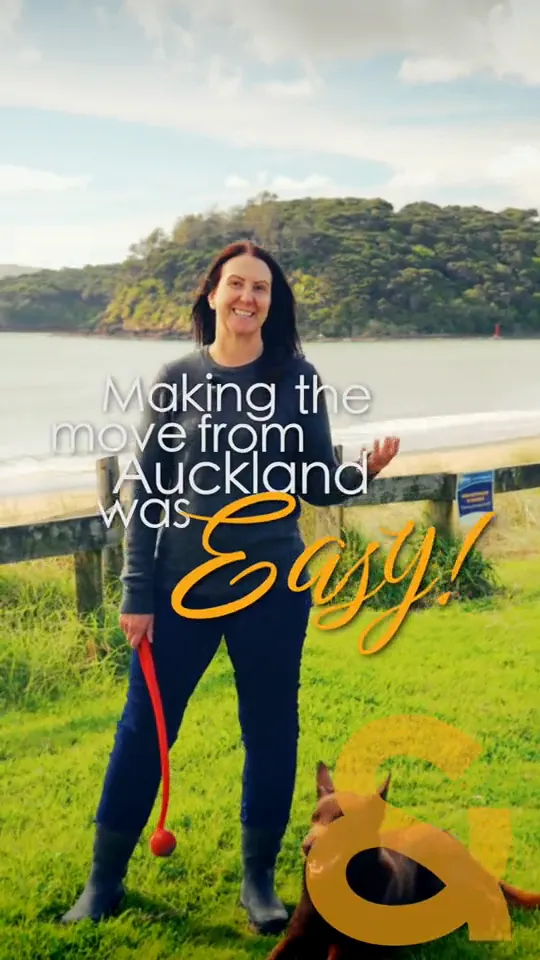 Nancy Loane on the beach with her dog, with subtitles